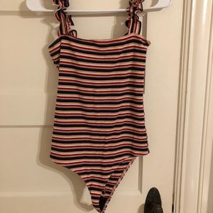Bodysuit with colorful stripes and fun frilly straps!